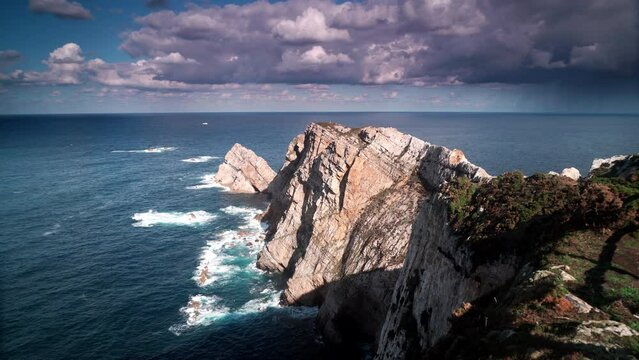 Seascape of Atlantic ocean and Asturias rocky coast at Cape Penas. Sea shore with high cliffs in north Spain.