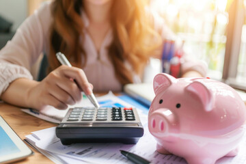 Women calculate expenses with calculator and piggy bank. Tax time, finance, investment and savings...