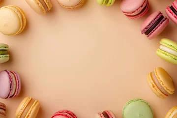 Foto op Plexiglas circle of assorted colorful macarons on a pastel beige background with copy space © Klay