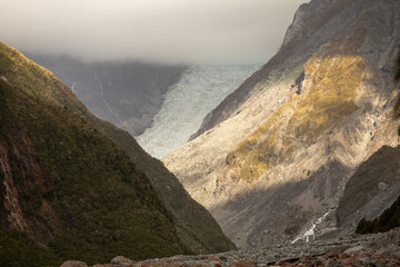 Cloud obscures part of the shrinking Fox glacier on the west coast of the South Island of New...