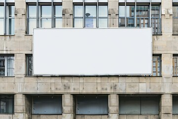 Obraz premium Blank billboard on the wall of a building in the city, mock-up