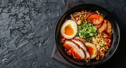 appetizing ramen bowl with egg, noodles, pork, and spicy broth