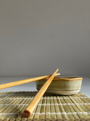 chopsticks and bowl of soy sauce
