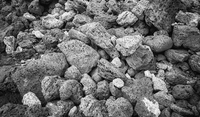 Black and white close up photo of pumice stones, nature background, Galapagos Islands, Ecuador. - obrazy, fototapety, plakaty