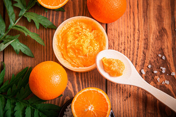 Orange scrub for face or body. Cosmetic product made of natural ingredients.