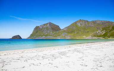 Sandy beach with clear water in Norway, Lofoten Islands, Haukland