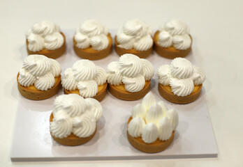 meringue chocolates in crispy biscuit and pastry cream