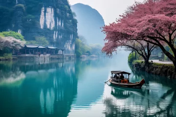 Gordijnen chinese landscape painting of a boat on a river with cherry blossoms © Molostock