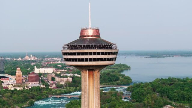 Aerial Panning Shot Of Famous Skylon Tower In Residential City Against Clear Sky - Niagara Falls, Canada