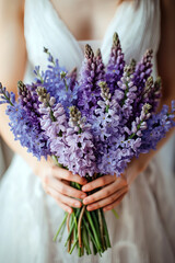Fototapeta premium Beautiful wedding bouquet in the hands of a bride in a wedding dress