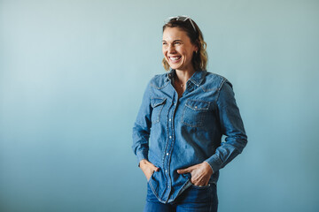 Business woman celebrating her success in denim clothing