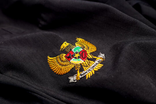 Garuda Pancasila symbol on black cloth. Embroidered images on fabric