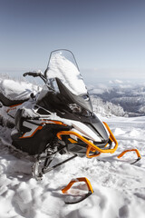 snowmobile in the winter mountains
