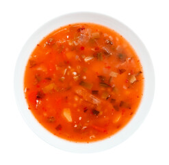 White plate with vegetable soup on a white background. View from above. Isolate plates with meat soup
