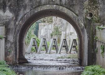 The arched gateway of Jamor river in Queluz