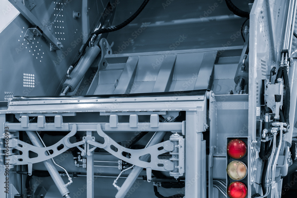 Aufkleber A modern machine for transporting waste waste with a press and automatic loading and unloading, rear view of the mechanization and trash can
