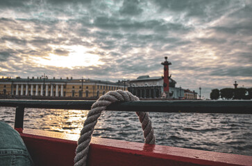 view from a ship on the Neva against the backdrop of Vasilievsky Island and a menacing sky, close...