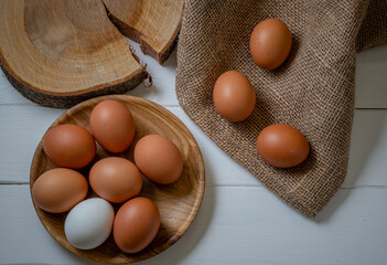 Fresh chicken eggs on the table, selective focus