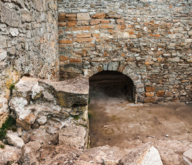 The medieval ruins of the fortress. The passage in the form of a