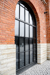 Stylish brick facade with black frames on the windows 