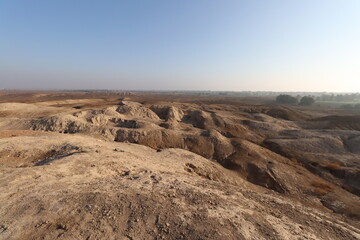 Ancient city of kish , 3100 bc , al-ahmar hill in Babylon in Iraq , ancient ruins with blue sky	