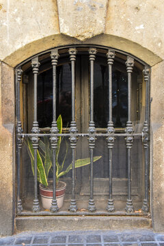 old Street windows by the streets of Barcelona with metal bars