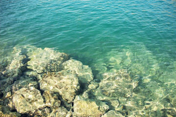 Clear sea water surface in bright sunlight