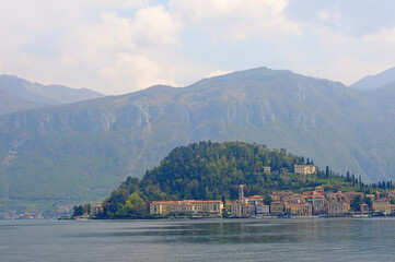 The village of Bellagio with mountains in the back at Lake Como, Italy, on a clouded spring day