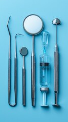 Dental instruments and a syringe on a blue background