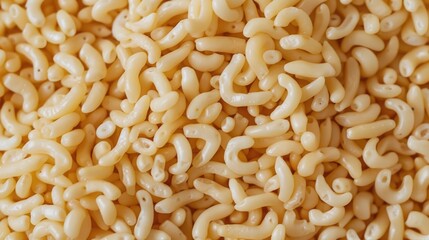 Close up of a pile of macaroni noodles, perfect for food-related designs