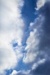 White clouds in the sky and between them you can see the blue sky