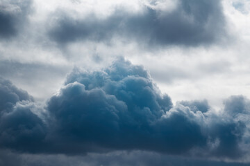 Dark blue cloud in the sky close-up, cloud as a storm warning, approaching storm - obrazy, fototapety, plakaty