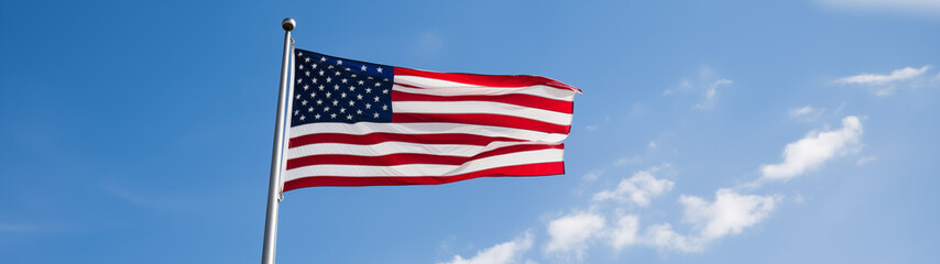 Vivid American Flag Fluttering in a Bright Blue Sky