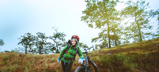  Asian women Travel photograph Nature. Travel relax ride a bike Wilderness in the wild. Thailand - 766494989