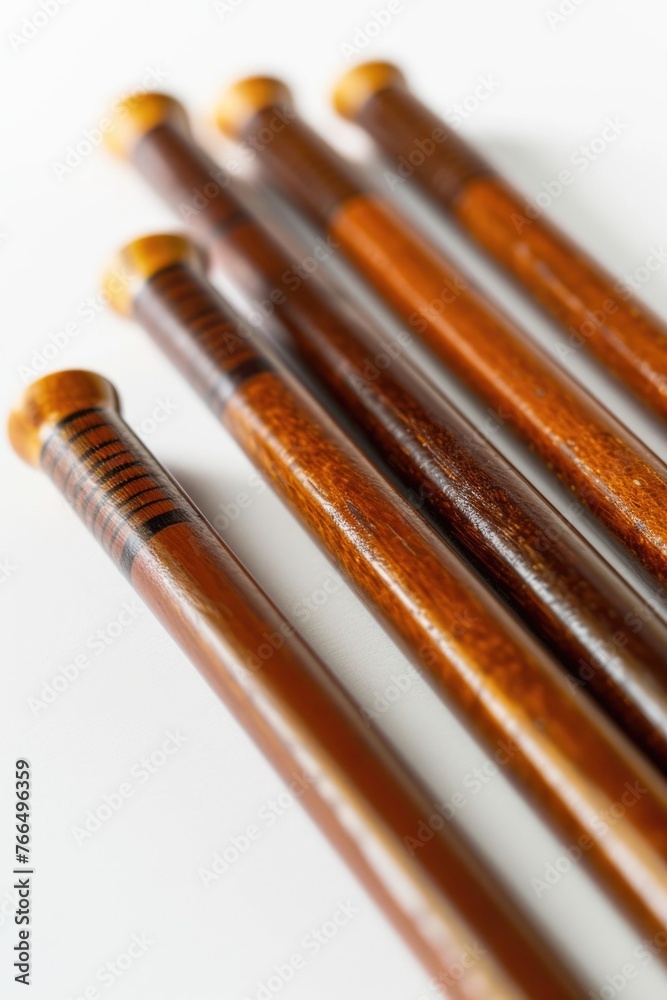Poster Close up view of a group of wooden sticks, perfect for background or texture use