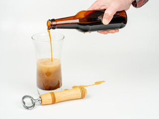 Actively pouring beer into a glass