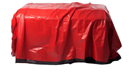 A vibrant red cover delicately placed on a wooden table