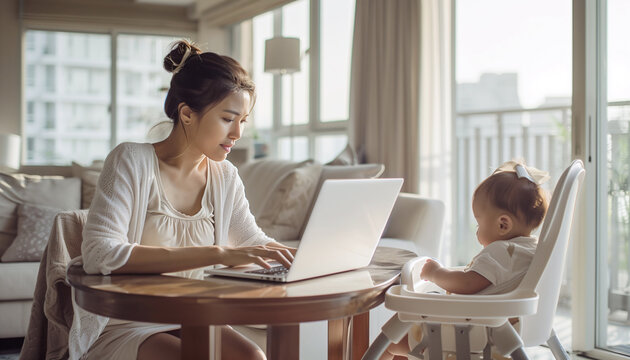 Beautiful cute scene of mom and kid uniting. Mother working on laptop doing quarterly account report, daughter child sitting in baby seat,  waiting. Maternity or Parental leave, Tax time concept image