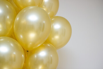 golden mother of pearl balloons in a bunch