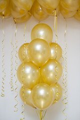 golden mother of pearl balloons in a bunch