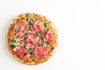 Pizza with prosciutto, ham, arugula, tomatoes, pesto, cheese and parmesan. Italian cuisine. 