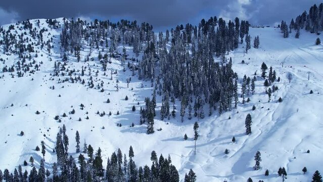 Drone footage of snow covered Malam Jabba Ski slope in Himalayan Mountains during winter in Swat Khyber Pakhtunkhwa Pakistan