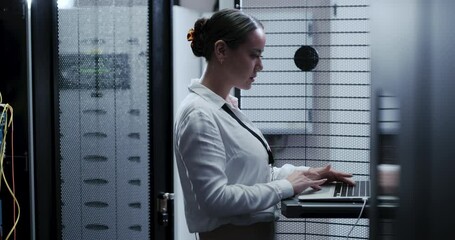 Business woman, data center and computer for maintenance, system and hardware or software backup in cybersecurity. Asian technician with laptop engineering, coding inspection and server room solution