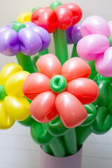 Fototapeta na wymiar bouquet of flowers from balloons with a bow