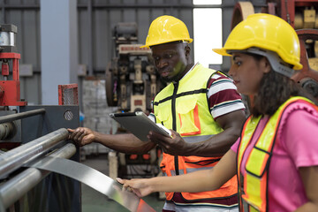 Manufacturing industrial concept. Male and female engineer workers working at manufacturing...