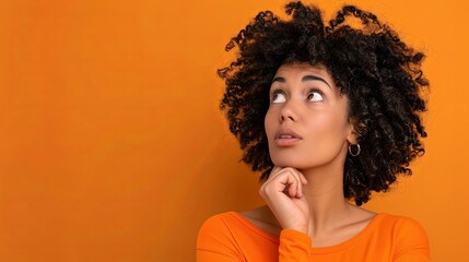 Shocked European woman while watching look above isolated blue background .Image of excited screaming young woman standing isolated over orange background. Looking camera.Portrait American woman - obrazy, fototapety, plakaty