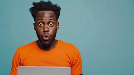 Shocked African woman while watching in on laptop isolated blue background .Image of excited screaming young woman sitting isolated over blue background. Looking camera.Portrait African American man - obrazy, fototapety, plakaty
