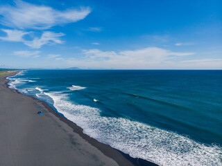 Beautiful nature Landscape of Khalaktyrsky beach with black volcanic sand coast of North Pacific...