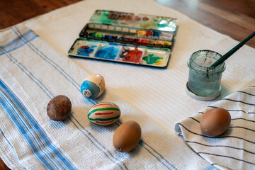 Painted easter eggs with different pattern for holidays on table