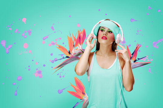 A woman wears headphones, surrounded by vibrant splashes of paint and bird of paradise flowers, evoking a sense of dynamic music experience on a teal background.